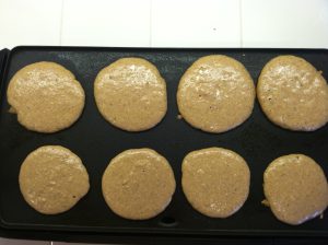 Wheat pancakes on griddle