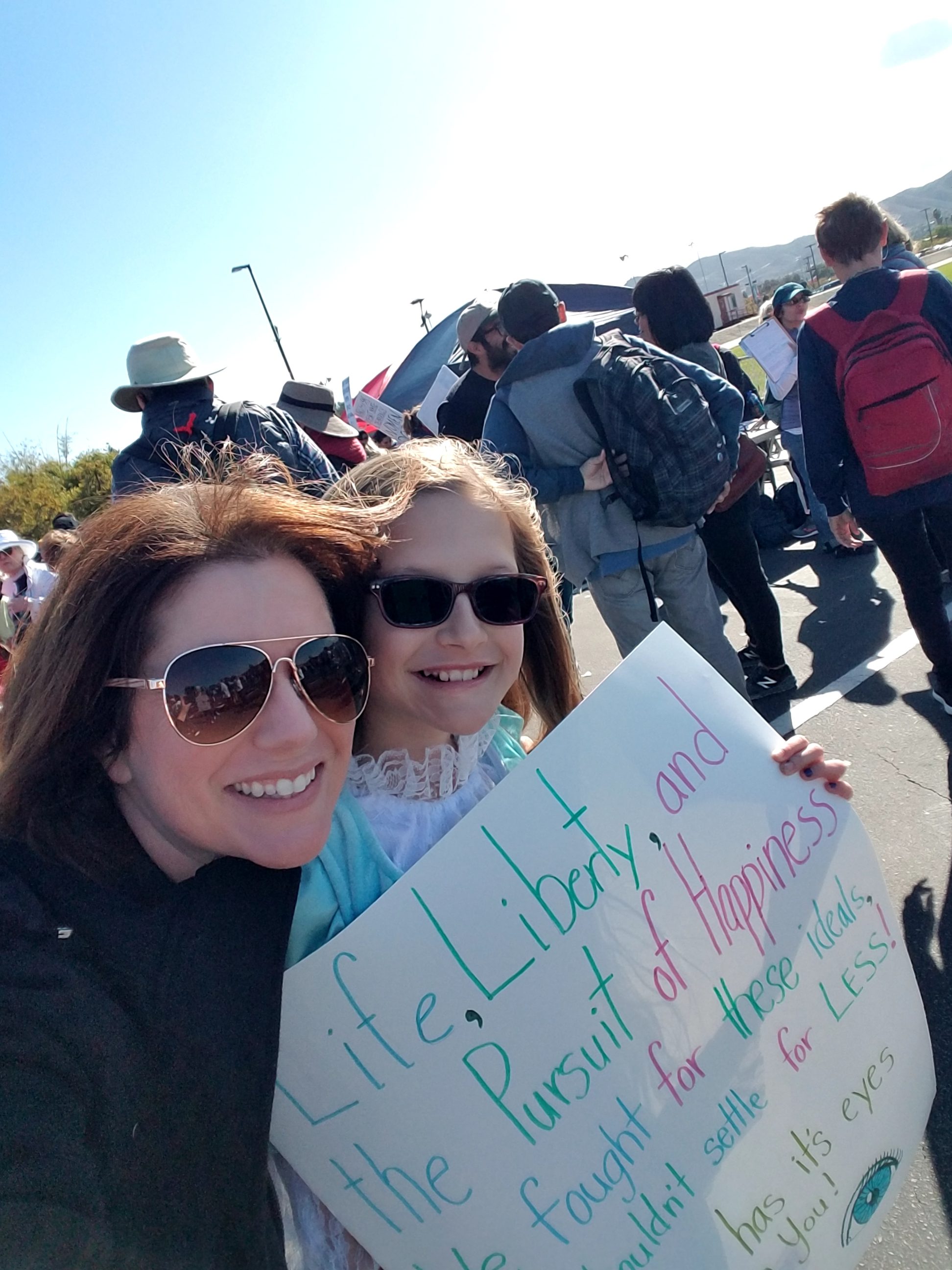 mother and daughter at womens march